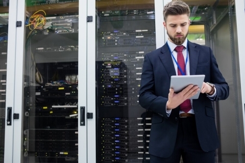 IT manager monitoring and managing dedicated server hardware in a data center